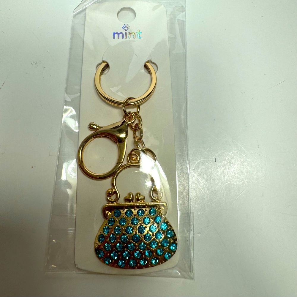 NWT. Blue rhinestone bag purse key chain or bag charm. Gold tone lobster claw